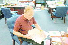 Geoff Dornan/Nevada AppealSen. David Parks, D-Las Vegas, chairman of Legislative Operations and Elections, sorts through reports, correspondence, amendments and other paperwork the day after the end of the 2011 session. He filled several boxes with trash.