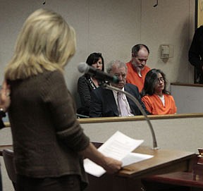 Phillip and Nancy Garrido, background right, are seen as Terry Probyn, whose daughter, Jaycee Dugard, was kidnapped by the Garridos in 1991, reads a statement during their sentencing hearing at the El Dorado County Superior Court in Placerville,  Calif., Thursday, June 2, 2011.  Calling him the &quot;poster child&quot; of a sexual predator, Judge Douglas C. Phimister sentenced Phillip Garrido to 431 years to life and Nancy Garrido to 36 years to life in state prison for the 1991 kidnapping of Dugard.(AP Photo/Rich Pedroncelli, pool)