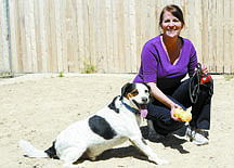 Shannon LItz/Nevada Appealonya Ruffner, volunteer coordinator for the Carson City Animal Shelter, plays with Buddy, an Australian cattle dog mix, in the yard at the shelter on Friday afternoon.