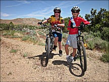 Courtesy Jeff MosrLocal cycling advocate Jeff Moser took his son, left, and friend out for a mountain bike ride this week.