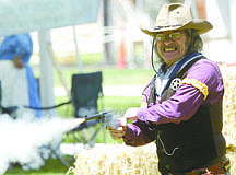 Shannon Litz/Nevada AppealJohn Miltenberger of Fernley, playing the Sheriff Augustus Ash, does a show with the Nevada Gunfighters at the Carson City Rendezvous at Mills Park on Friday afternoon.