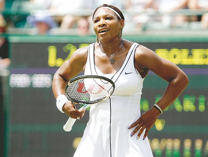 Serena Williams of the US reacts after a point during her match against France&#039;s Marion Bartoli at the All England Lawn Tennis Championships at Wimbledon, Monday, June 27, 2011. (AP Photo/Anja Niedringhaus)