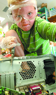 Jim Grant/Nevada AppealBen Heaton, 7, dismantles an old computer to build a robot at Camp Invention on Tuesday afternoon at Bethlehem Lutheran school.