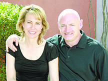 FILE - In this undated file photo provided by the office of Rep. Gabrielle Giffords, Giffords, D-Ariz., left, is shown with her husband, NASA astronaut Mark Kelly. The Arizona Democrat and her husband are working on a memoir that Scribner will publish at a date to be determined. The book, currently untitled, will be an intimate chronicle of everything from their careers and courtship to the Jan. 8 tragedy when a gunman shot Giffords in the head during a political event in Tucson, Ariz.   (AP Photo/Office of Rep. Gabrielle Giffords, File)  NO SALES