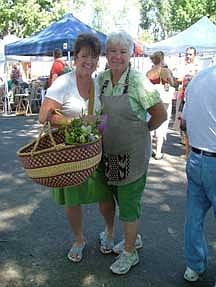 Submitted photoMarket Manager Linda Marrone, right, and Tammy Westergard enjoy a Saturday morning at the Downtown Farmers Market. This photo was one of six main photos used in a recent three-page spread in the national Country Woman magazine featuring the Carson City&#039;s market.