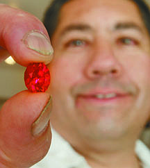 Jim Grant/Nevada AppealGem cutter Tobin Rupert holds an 8.56 carat ruby purchased in Africa. He said people are welcome to stop by his store to see the gem.
