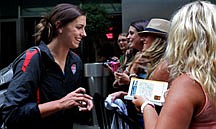 Alex Morgan greets fans after she and other members of the U.S. soccer team arrived in New York&#039;s Times Square on Monday, July 18, 2011, the day after the team&#039;s loss to Japan in the Women&#039;s World Cup final in Germany. (AP Photo/Craig Ruttle)