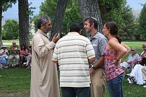 Imam Abdelwahed Awad and Sherif Elfass of the Northern Nevada Muslim Community speak with Rabbi Evon Yakar and his wife, Rachel, of Temple Bat Yam at the Interfaith Picnic at Mills Park July 31. The interfaith group was pleased to welcome these newest clergy to our region.
