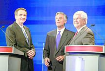 Republican presidential candidates former Minnesota Governor Tim Pawlenty, left, former Utah Gov. Jon Huntsman, center, former House Speaker Newt Gingrich, are pictured during a commercial break at the Iowa GOP/Fox News Debate at the CY Stephens Auditorium in Ames, Iowa, Thursday, Aug. 11, 2011. (AP Photo/Charlie Neibergall, Pool)