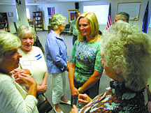 Ann Romney, wife of Republican presidential hopeful Mitt Romney, center right, talks with party loyalists at the Douglas County Republican Party headquarters Wednesday, Aug. 24, 2011 in Minden, Nev. Romney was in northern Nevada to seek support for her husband. (AP Photo/Sandra Chereb)