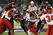 Nevada Reno&#039;s Mark Lampford rushes for 13-yards in the fourth quarter against Eastern Washington in an NCAA college football game in Reno, Nev., on Thursday, Sept. 2, 2010. (AP Photo/Cathleen Allison)