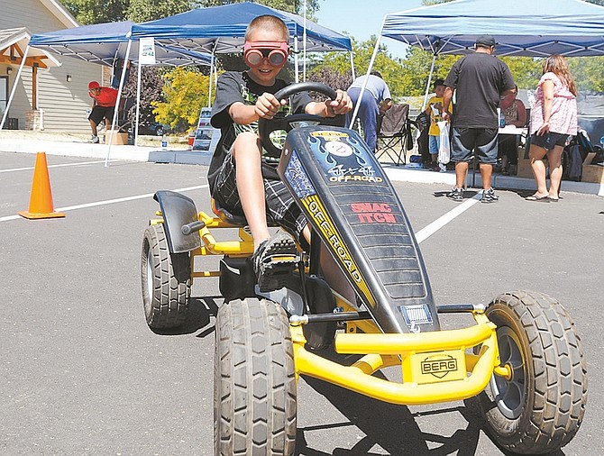 Photos by Shannon Litz/Nevada AppealABOVE: Nine-year-old Evan Simpson attempts to drive while wearing the drunk goggles that simulate a .08 blood alcohol content on Saturday during the Washoe tribal youth day.