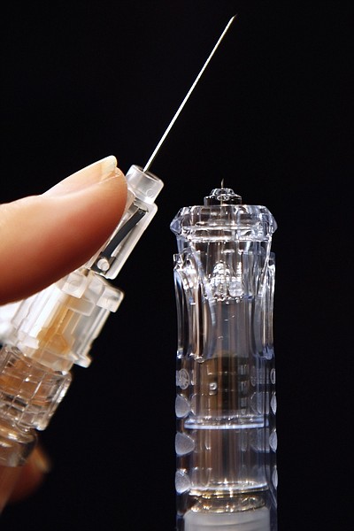 Flu shots have long been injected deep into muscle, requiring a needle an inch long or longer, such as the needle seen at left. However, a new version named: Sanofi Pasteur&#039;s Fluzone Intradermal, hitting the market this fall, at right, is less than a tenth of an inch long, the first flu vaccine that works by injecting just into the skin, as compared in Washington, on Tuesday, Aug. 30, 2011. (AP Photo/Jacquelyn Martin)