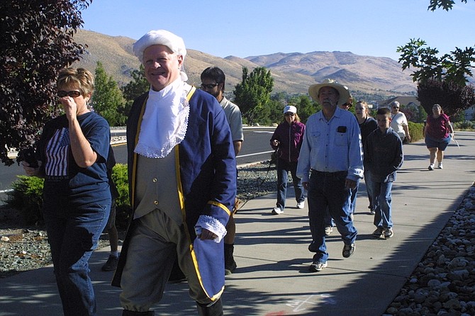 Sandi Hoover / Nevada AppealCarson City resident Ron Knecht, dressed as Gen. George Washington, joins dozens of others Saturday during a Walk for the Constitution up College Parkway.