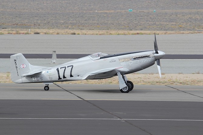 Pilot Jimmy Leeward taxis his P-51 Mustang for takeoff prior to the ill fated flight at the Reno Air show on Friday, Sept. 16, 2011 in Reno Nevada. The World War II-era fighter plane flown by Jimmy Leeward plunged Friday into the edge of the grandstands during the popular air race creating a horrific scene strewn with smoking debris. (AP Photo/Ward Howes)
