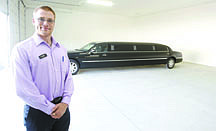 Shannon Litz/Nevada AppealChauffeur Grant Gianola in the Hwy50 Toy Shed with his limousine on Wednesday afternoon.