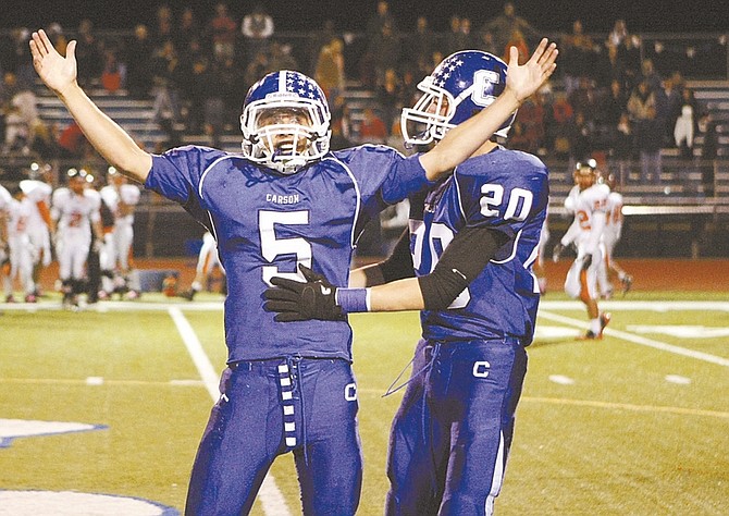 Shannon Litz/Nevada AppealCarson&#039;s Austin Pacheco (No. 5) celebrates his game-winning field goal with teammate Logan Krupp Friday night. Pacheco&#039;s 42-yard field goal gave Carson a 31-29 win. For more photos go to nevadaappal.com/photos.