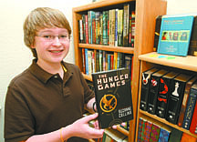 Jim Grant/Nevada AppealChallen Wright displays his favorite book, &quot;The Hunger Games.&quot;