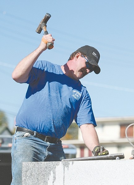 Jim Grant/Nevada DayRich Thomas uses a hammer and bit to drill a hole more than eight inches deep into a slab of granite at the annual single-jack rock drilling Contest on Saturday. For more photos to go to nevadaappeal.com/photos.