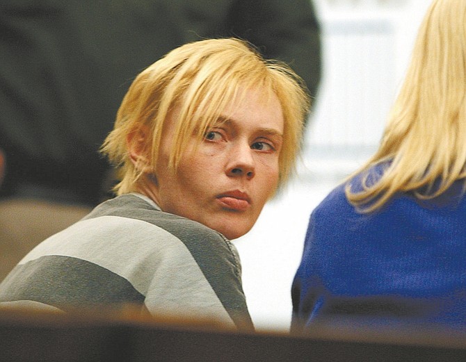 Nevada AppealAccused bank robber Rachel Barrett looks back into the gallery in Carson City Justice Court on Tuesday where she waived her preliminary hearing and signed an agreement in which she&#039;ll plead guilty to the Oct. 11 robbery at Nevada State Bank.