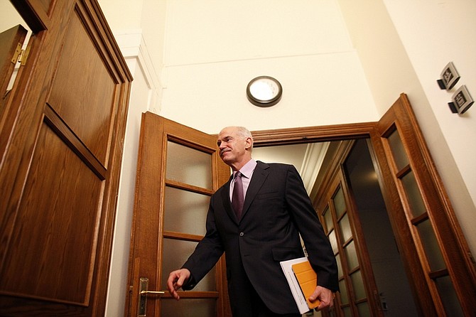 Greece&#039;s Prime Minister George Papandreou arrives for a cabinet meeting at the parliament in Athens on Sunday, Nov. 6 2011. Greek leaders struggled for a second day to end an ongoing political crisis, under intense pressure to ensure the country doesn&#039;t go bankrupt in the next few weeks and that it remains in the eurozone. Papandreou informed cabinet members that he asked Greek President Karolos Papoulias for an urgent meeting with opposition leader Antonis Samaras. (AP Photo/Kostas Tsironis)