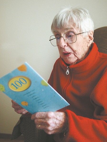Jim Grant / Nevada AppealWilla Ramsden reads a birthday card recently. Ramsden celebrated her 100th birthday Sunday at the Eagle Valley Nursing Home.