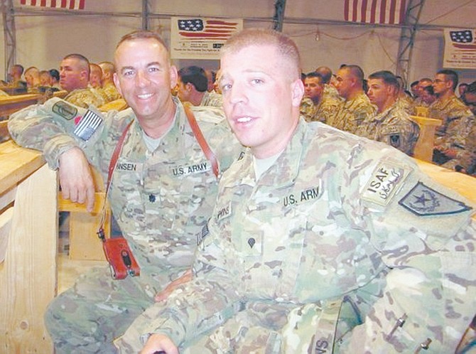 Courtesy SSG Adam Fenner422nd Expeditionary Signal Battalion commander Lt. Col. Jeffrey Hansen, left, of Dayton, and Spc. Tyler Hopkins of Reno attend an event at Kandahar Air Field, Afghanistan.