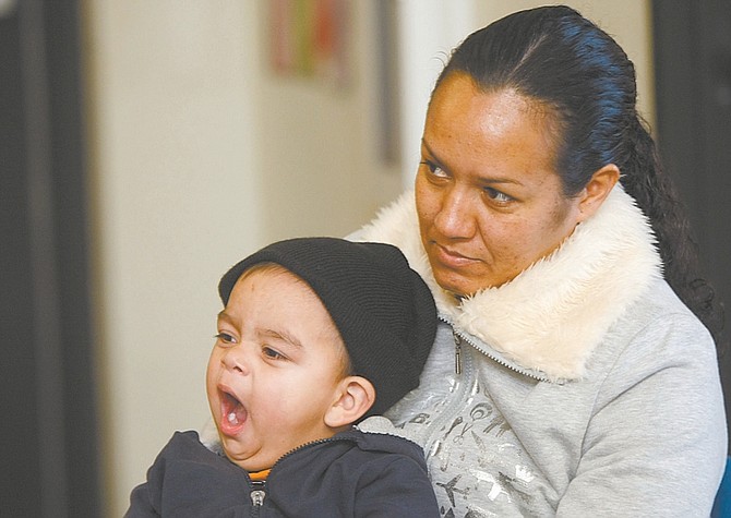 Shannon Litz/Nevada AppealMaria Nunez listens while 15-month-old Brayan yawns during the parents and preschoolers group on Tuesday at the Boys &amp; Girls Cubs of Western Nevada.