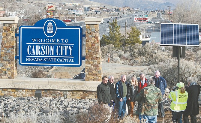 Jim Grant / Nevada AppealCarson Area Metropolitan Planning Organization board members, from left, Jim Mallery, Jim Smolenski, Charles DesJardins, Shelly Aldean, Bob Crowell and county supervisor John McKenna pose for a picture on Tuesday morning after the unveiling of the welcome sign erected on the south end of Carson City.