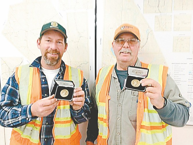 Courtesy Nevada maintenance workers John Klapper and Frank &quot;Bud&quot; Blazek display the bronze governor&#039;s medallions they received from Gov. Brian Sandoval after finding a wallet and returning it.