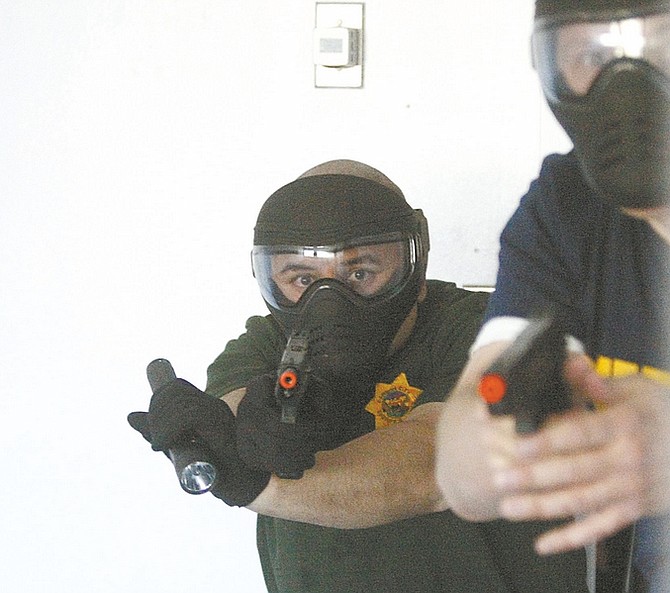 Shannon Litz / Nevada AppealReserve deputies clear a room during active-shooter training on Saturday in the Kinkead Building in Carson City.