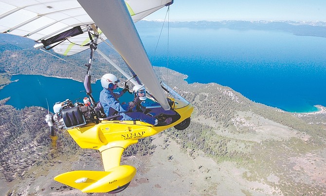 Photo courtesy of Paul HamiltonFlight instructor Paul Hamilton, front, and Nevada Appeal reporter Nick Coltrain soar in an Apollo Trike light-sport aircraft over the Sierra Wednesday with Lake Tahoe and Marlette Lake in full morning glory.