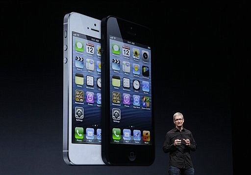  (AP Photo/Jeff Chiu)Apple CEO Tim Cook speaks in front of an image of the iPhone 5 during an Apple event in San Francisco, Wednesday, Sept. 12, 2012.
