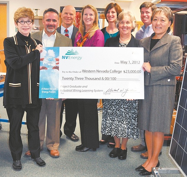 CourtesyNV Energy presents a ceremonial check for the $23,000 donation to Western Nevada College educational and student success programs. From left, WNC President Carol Lucey, NV Energy Economic Development Executive Jeff Brigger, WNC Dean of Students John Kinkella, WNC Electronics Professor Emily Howarth, WNC Foundation Director Katie Leao, WNC Vice President of Academic and Student Affairs Connie Capurro, WNC Foundation Chair Jed Block and NV Energy Vice President of External Strategy Mary Simmons.