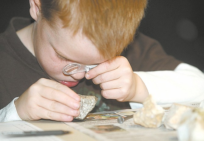Photos by Shannon Litz/Nevada AppealSix-year-old Colin Favero uses a magnifying glass to look at a rock at The Children&#039;s Museum of Northern Nevada on Saturday morning.