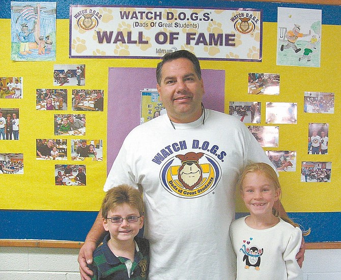 Courtesy photosTed Rupert, with children Jett, 6, and Keela, 7, volunteers with the Watch DOGS at Fritsch Elementary Program. The program is aimed at getting fathers and other male role models involved in schools.