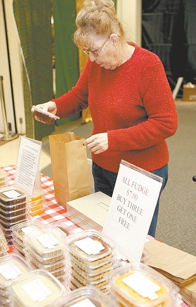 Shannon Litz/ Nevada AppealDiane Steele of Auntie D&#038;#8217;s Orchard Delights in Mound House packs an order of fudge at the Made in Nevada event at Carson Mall, which continues today from 11 a.m. to 6 p.m.