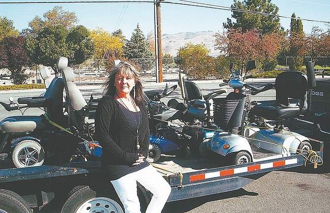 Courtesy PhotosTeresa Ohl of Capitol City Loans enjoys delivering power wheelchairs and scooters that her business donates, through the Carson City Senior Center, to people who need them.