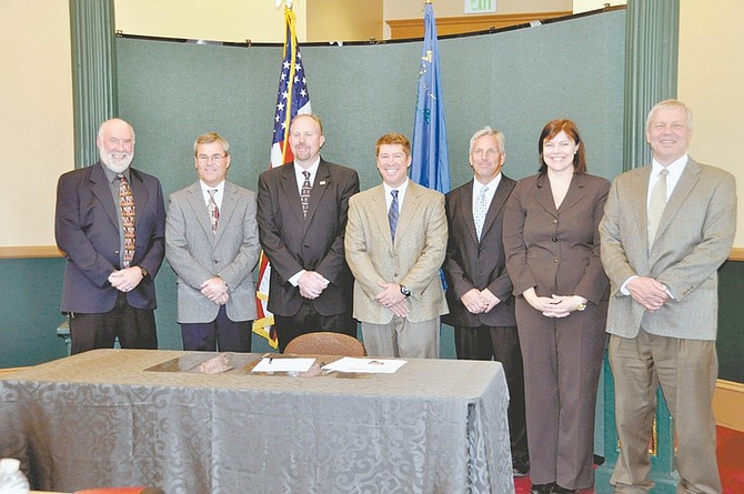 Published Caption: From left: John E. Sciacca, Robert K. Hartman, Christopher B. Smith, Drew Savage, Jason King, Alicia E. Kirchner and Bruce Peterson.