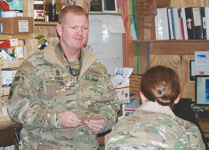 Photos by Steve Ranson / Lahontan Valley News1st Sgt. Don Gable of Bravo Company, 189th General Support Aviation Battalion, talks to Chinook pilot CW2 Casey Atkins.