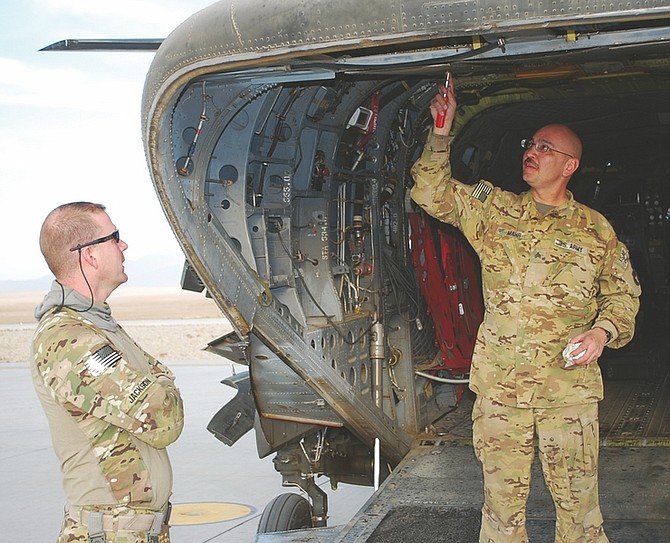 Steve Ranson / Lahontan Valley NewsDr. (Maj.) R. Dale Jackson, left, talks to Sgt. Robbie Mahr after a flight.