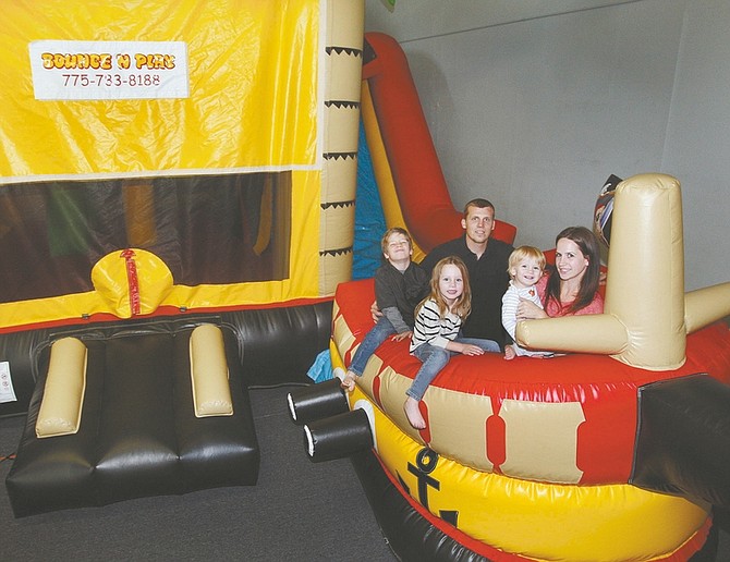 Jim Grant / Nevada AppealJarrod and Justine Pugliese, pictured with their children, from left, Jamison, 7, Addison, 4, and Bryson 17-months, have opened Bounce N Play Carson City at 3267 Research Way, Suite 210.