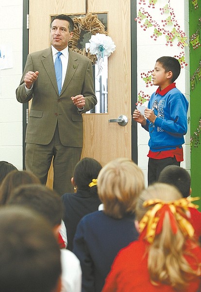Jim Grant / Nevada AppealGov. Brian Sandoval answers a political question from fourth-grade student Junior Alfredo Carrasco Solano at Empire Elementary school on Tuesday.