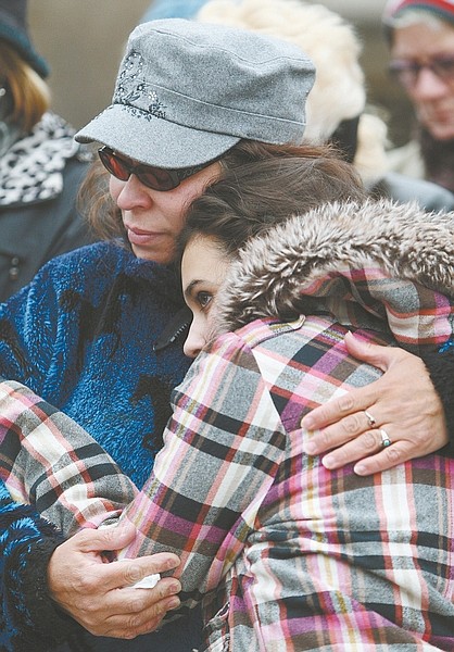 Jim GrantRia White and her 14-year-old daughter Sara embrace during a group prayer this afternoon for the victims and families of the Connecticut school shooting.