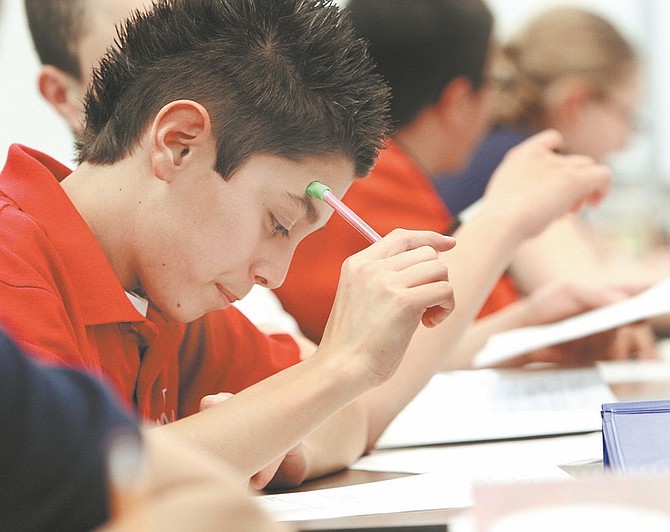 Jim Grant / Nevada AppealEagle Valley Middle School eighth grader Luis Hernandez works on an assignment in his U.S. History class on Tuesday. Under the Race to the Top grant, other schools in the district would be modeled after programs at Eagle Valley.