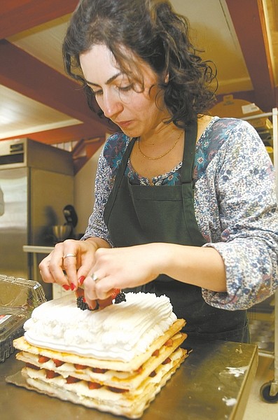 Nevada Appeal File PhotoLeila Tavakoli of LA Bakery puts the finishing touches of an elegant fruit torte earlier this year.