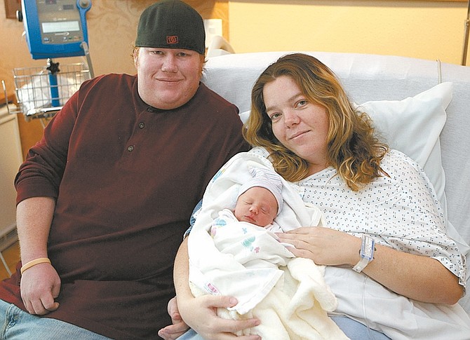Shannon Litz/ Nevada AppealAdam Buscay and Heather Harrison pose with Levi Alan Buscay Leuty on Wednesday.
