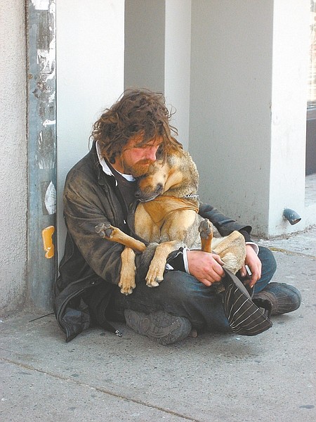 Courtesy photo by Kirsten StarcherThis picture of a homeless man and his dog, which is on the website for Pets of the Homeless, is the signature photo of the organization founded by Carson City&#038;#8217;s Genevieve Frederick.