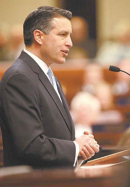 Shannon Litz / Nevada AppealNevada Gov. Brian Sandoval delivers the State of the State address on Wednesday evening.