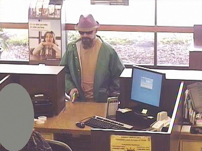 Tahoe Daily Tribune file photoThe Fedora Bandit, David Griffith Osborne, is shown at a Bank of the West in Gridley, Calif., in 2010. Osborne pleaded guilty to a string of heists, including the Gridley hold-up and two Lake Tahoe bank robberies, on Friday.